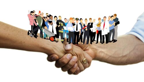 Ein handshake zwischen zwei Personen, auf den zwei Armen stehen mehrer Personen, die verschiedene Berufsgruppen darstellen