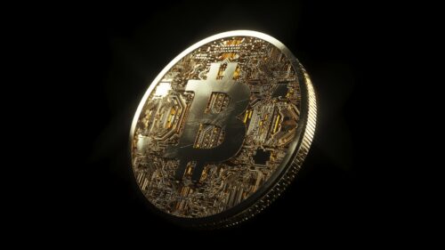 Goldenes Bitcoin Münze mit Bitcoin Logo oben drauf